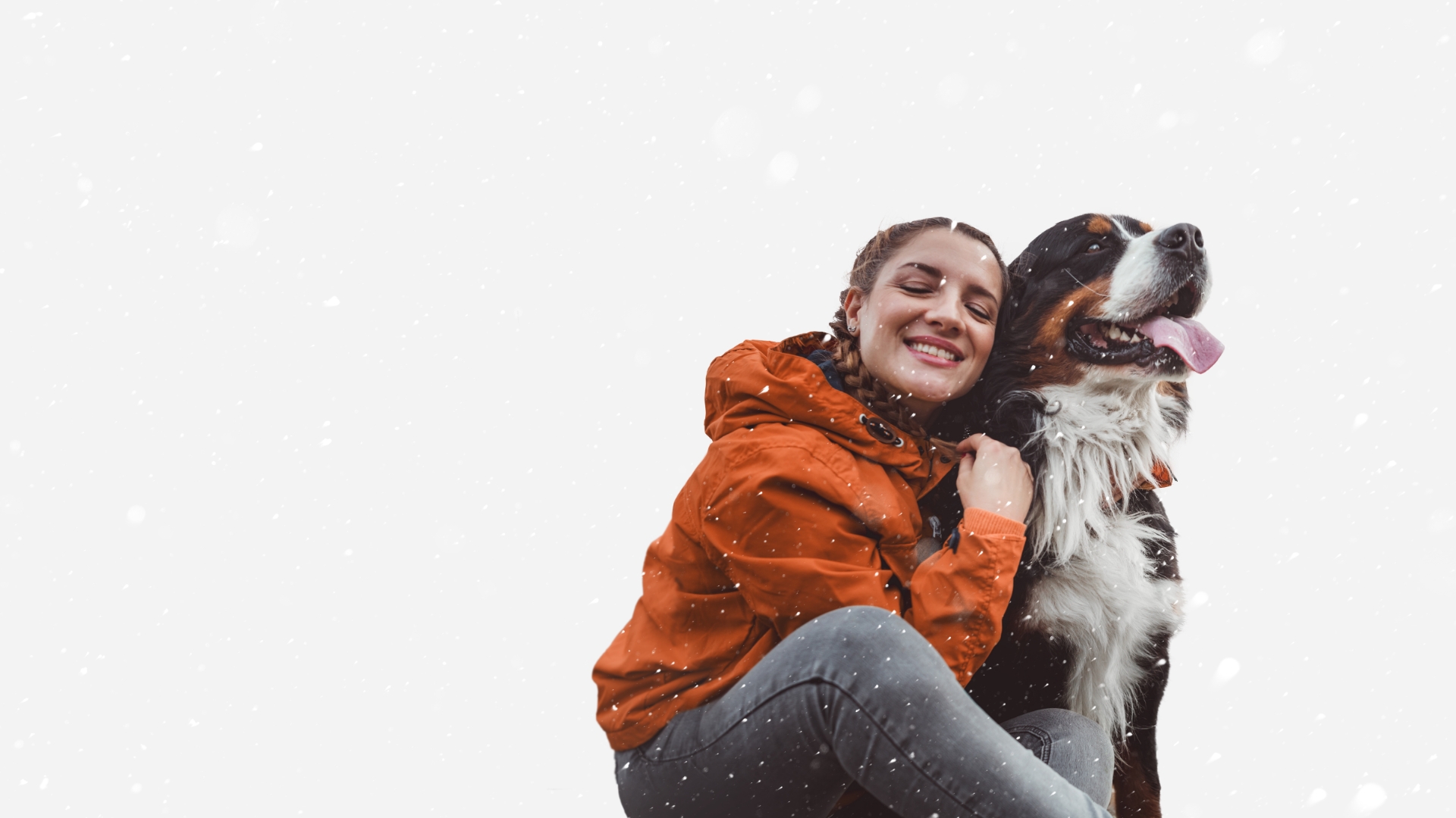 a woman hugging her dog