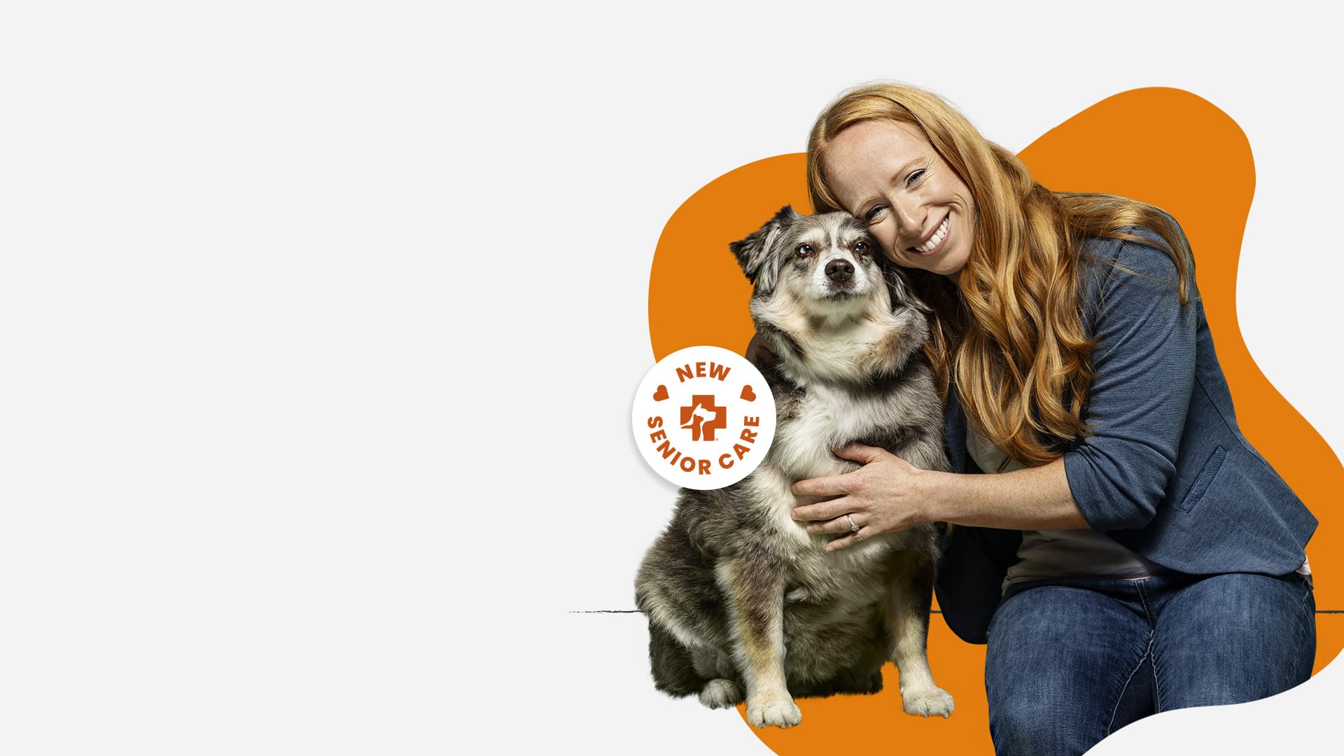 Image of a woman sitting next to an older dog