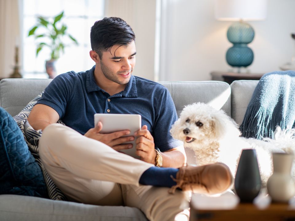 Puppy with Owner on sofa