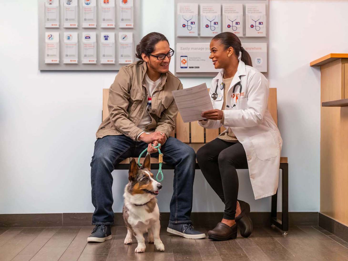 dog and owner talk with veterinarian