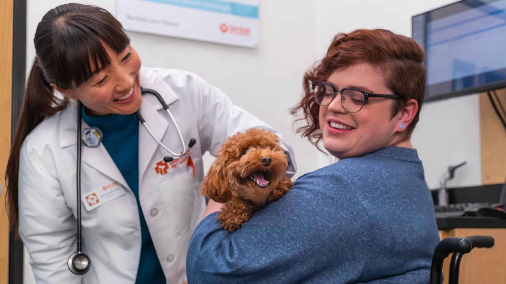 smiling veterinarian dog owner