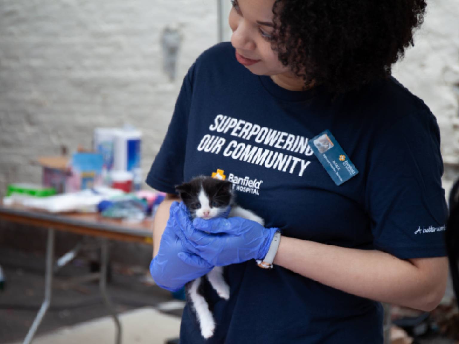 One of Banfield's young female associates holding a kitten at the Banfield Pet Hospital