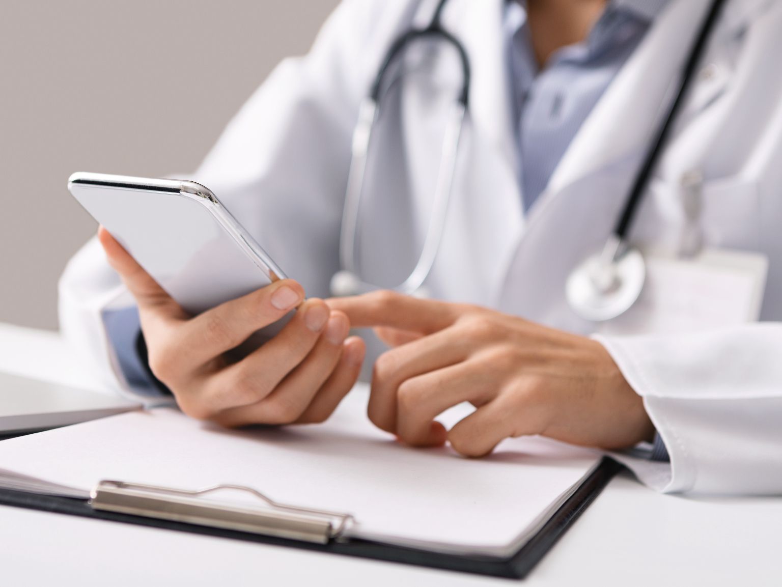 A veterinarian using a phone
